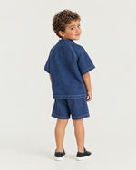 Little boy wearing the Romimi Léon Denim Shirt, back view