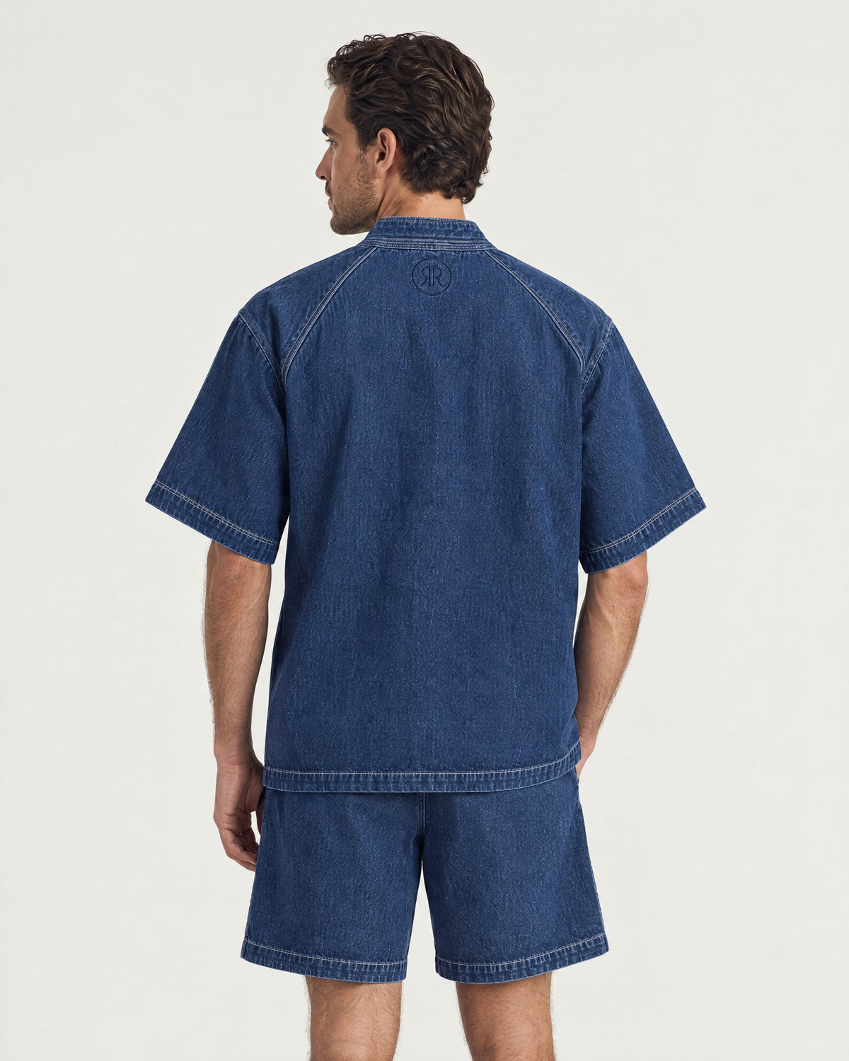 Man wearing the Romimi Léon Denim Shirt, back view
