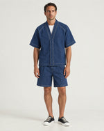 Man wearing the Romimi Léon Denim Shirt, full length