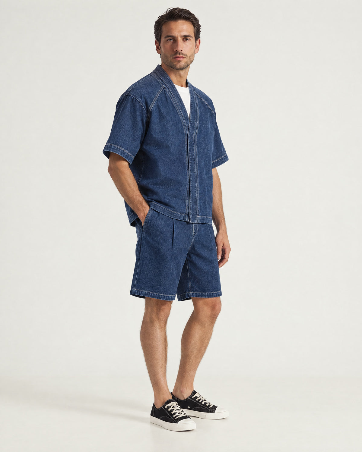 Man wearing the Romimi Léon Denim Short, three-quarter view
