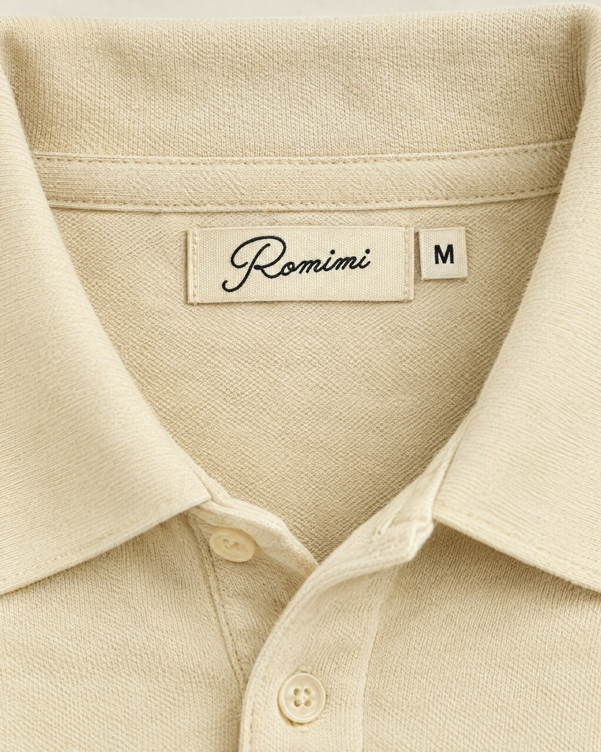 Romimi Mercerized Long Sleeve Polo in Beige, label close-up