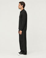 Romimi Mercerized Long Sleeve Polo in Black, side view, worn