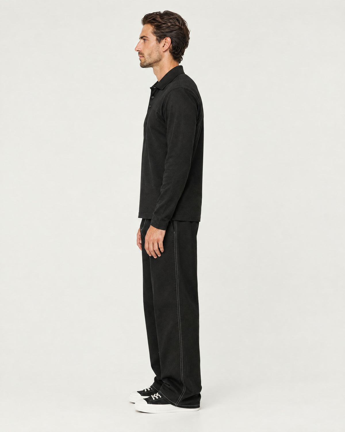 Romimi Mercerized Long Sleeve Polo in Black, side view, worn