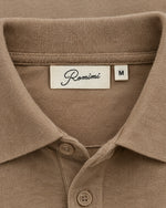 Romimi Mercerized Long Sleeve Polo in Camel, label close-up