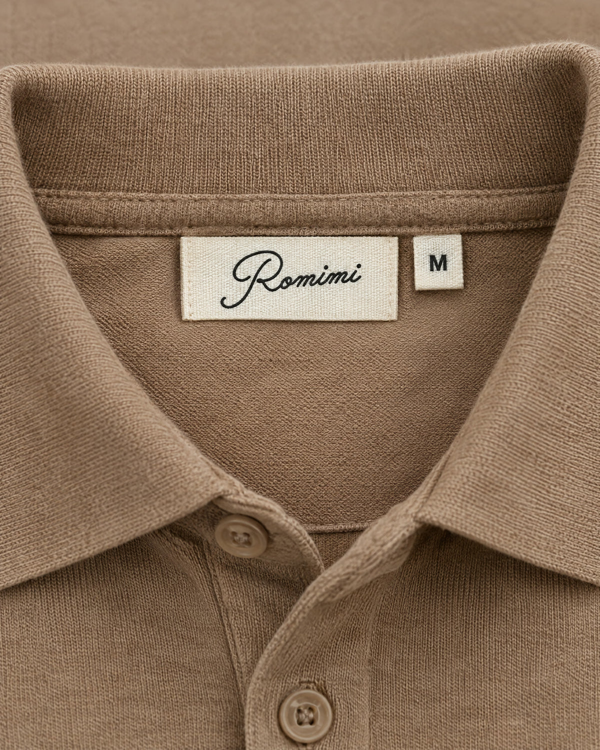 Romimi Mercerized Long Sleeve Polo in Camel, label close-up