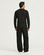 Romimi Mercerized Long Sleeve Tee in Black, back view, worn
