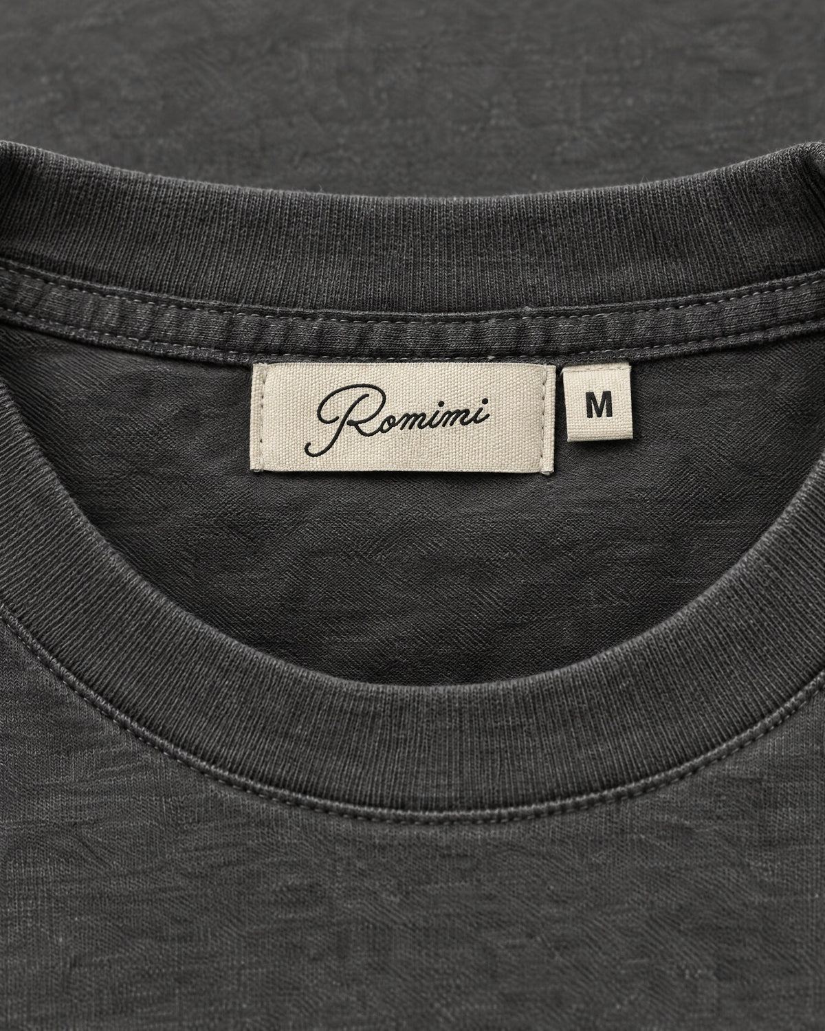 Romimi Mercerized Long Sleeve Tee in Charcoal, label close-up
