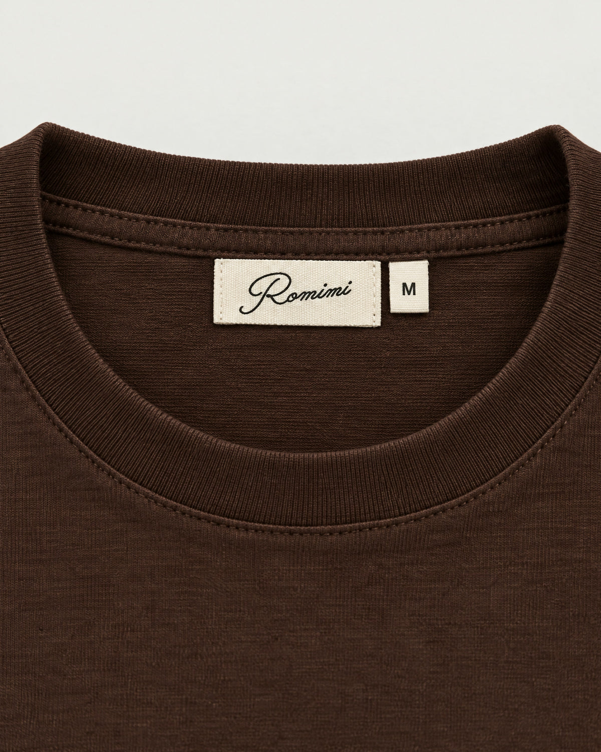 Romimi Mercerized Long Sleeve Tee in Dark Brown, label close-up