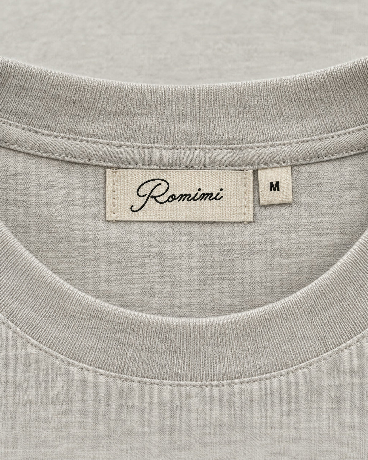 Romimi Mercerized Long Sleeve Tee in Light Grey, label close-up
