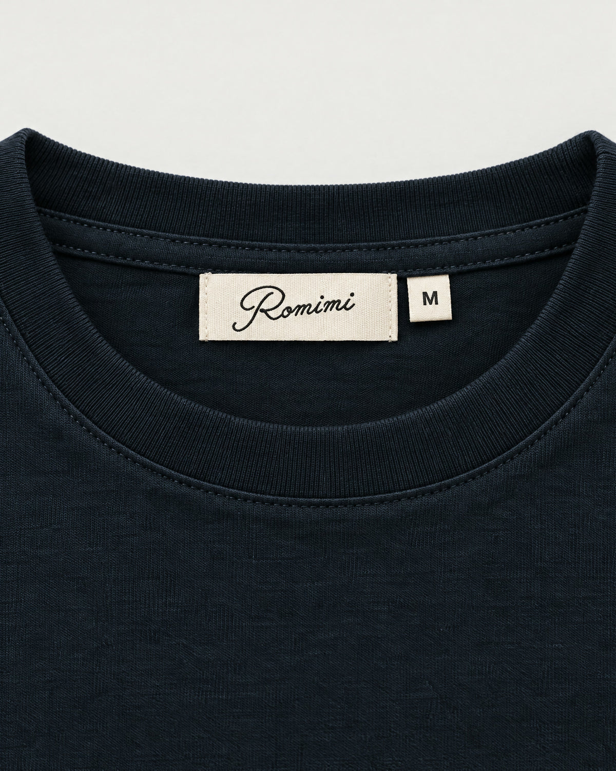 Romimi Mercerized Long Sleeve Tee in Navy, label close-up