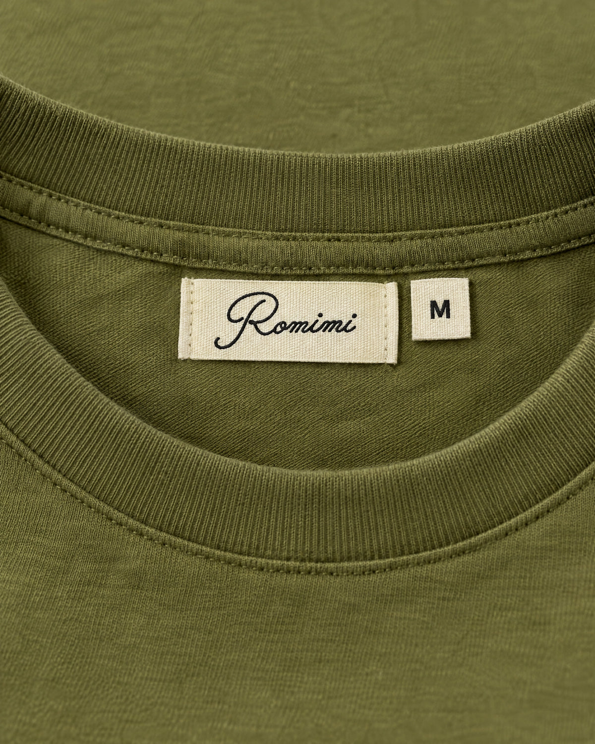 Romimi Mercerized Long Sleeve Tee in Olive, label close-up