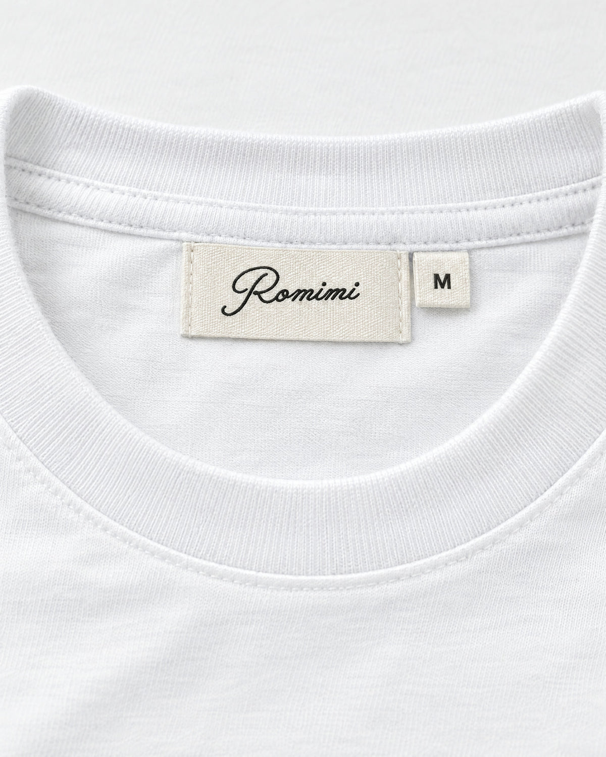 Romimi Mercerized Long Sleeve Tee in White, label close-up