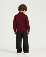 Little boy wearing the Romimi Merino Heritage Quarter-Zip, back view