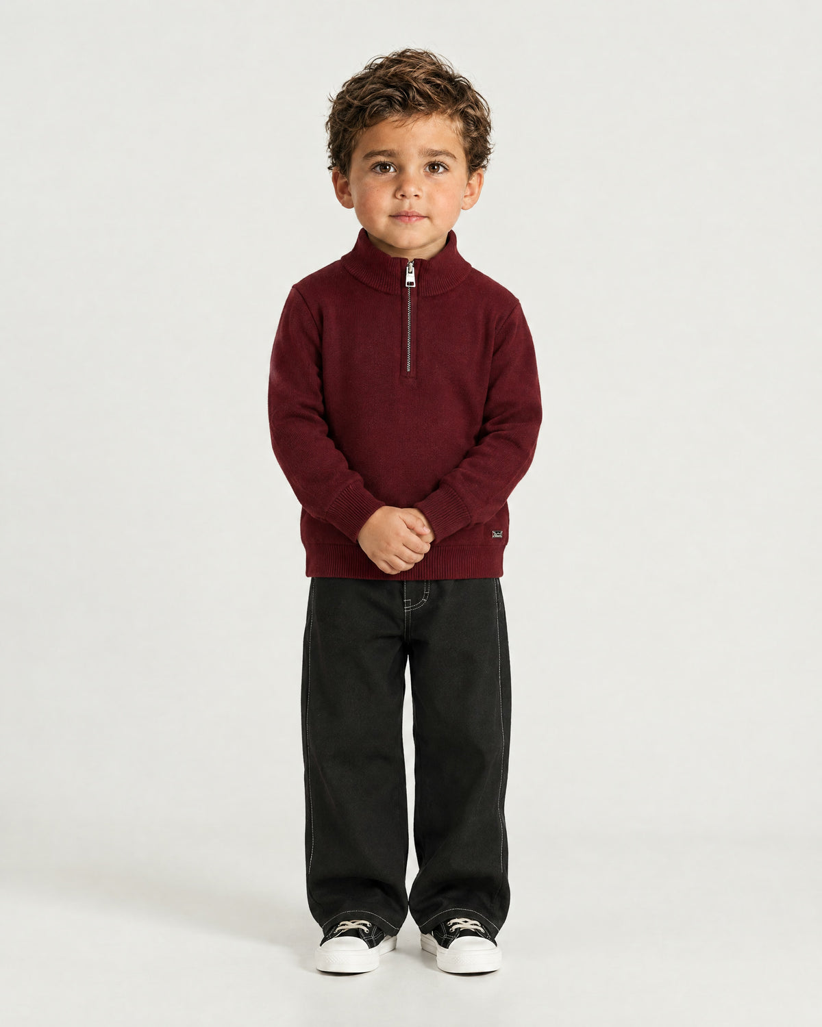 Little boy wearing the Romimi Merino Heritage Quarter-Zip, front view
