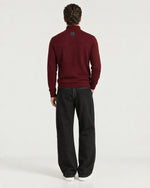 Man wearing the Romimi Merino Heritage Quarter-Zip, back view