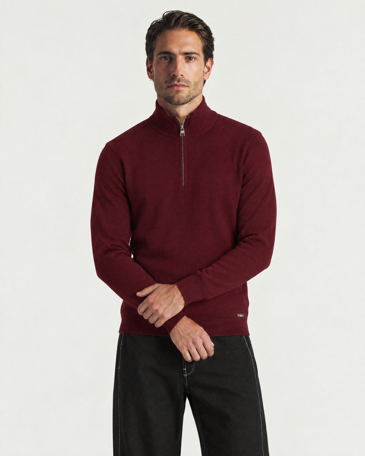 Man wearing the Romimi Merino Heritage Quarter-Zip, front view