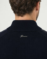 Detail of the Romimi padded knit cardigan in navy: the silver metal Romimi logo on the knitted back