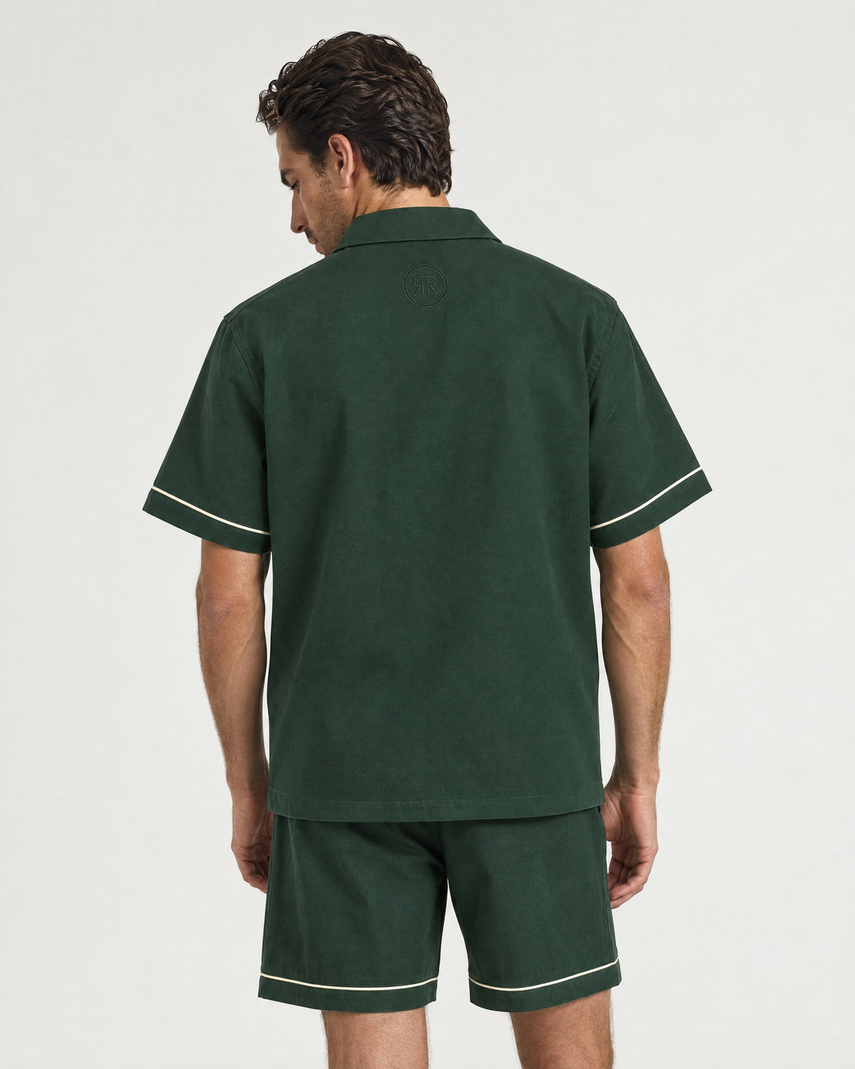 Man wearing the Romimi Paul Camp Collar Zip Shirt, back view