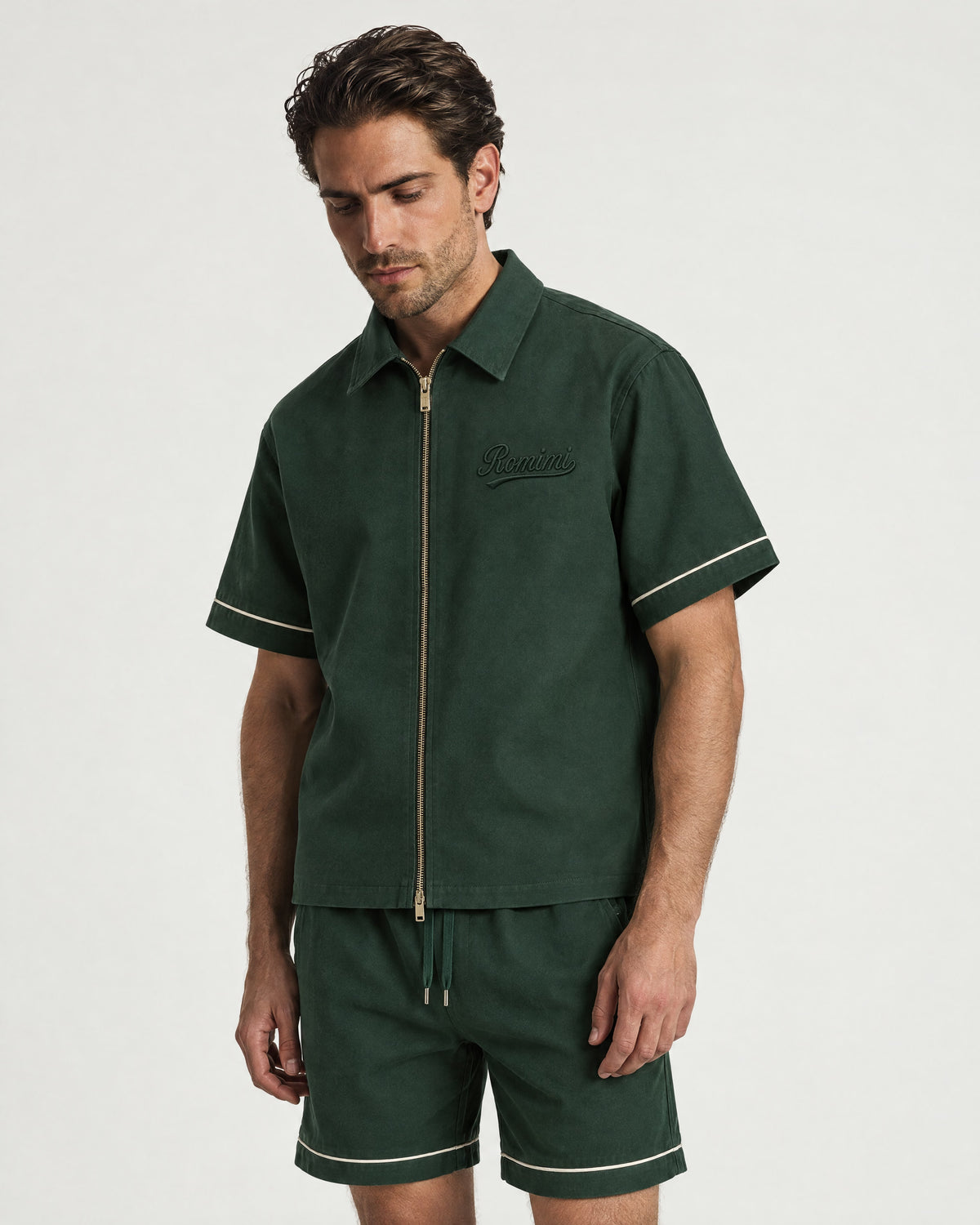 Man wearing the Romimi Paul Camp Collar Zip Shirt, three-quarter view
