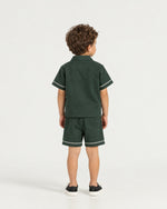 Little boy wearing the Romimi Paul Drawcord Shorts, back view