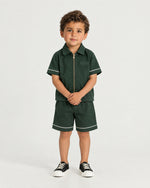 Little boy wearing the Romimi Paul Drawcord Shorts, front view
