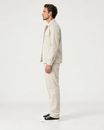 Romimi Relaxed Tech Suit in Beige, side view, worn
