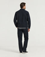 Romimi Relaxed Tech Suit in Black, back view, worn