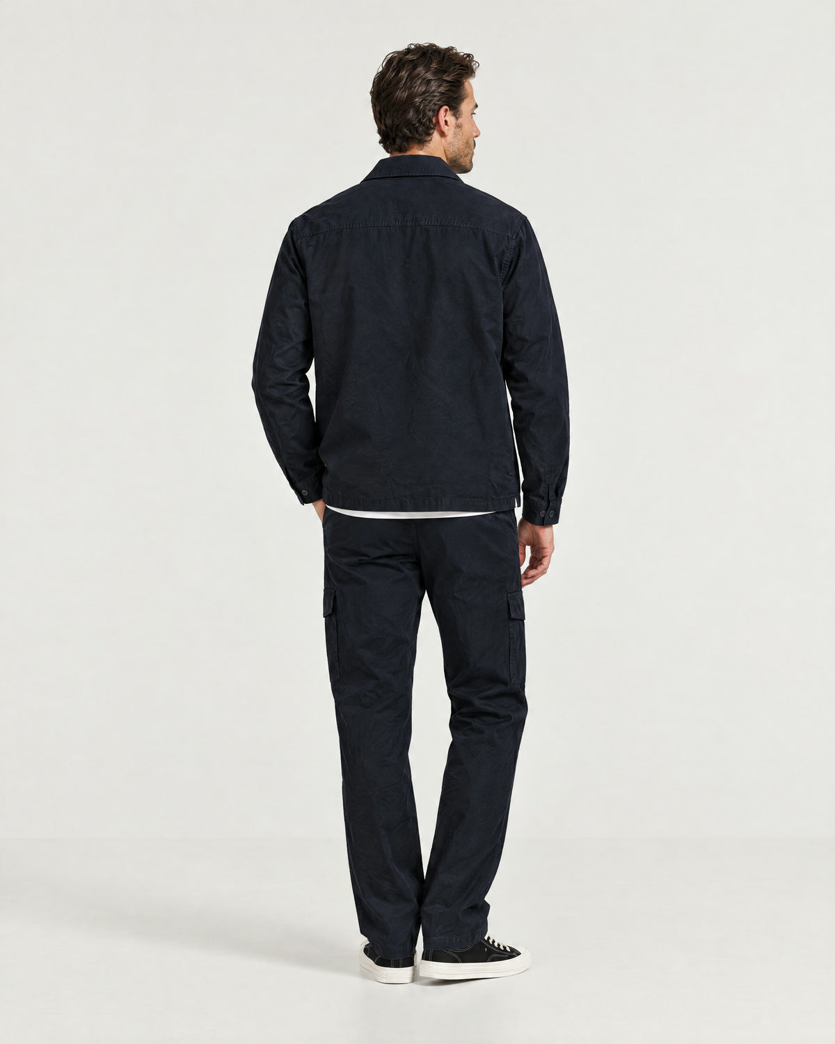 Romimi Relaxed Tech Suit in Black, back view, worn