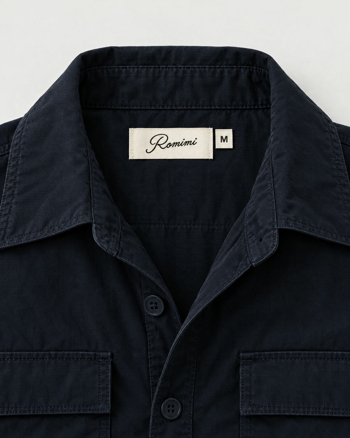Romimi Relaxed Tech Suit in Black, label close-up
