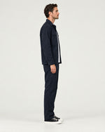 Romimi Relaxed Tech Suit in Black, side view, worn