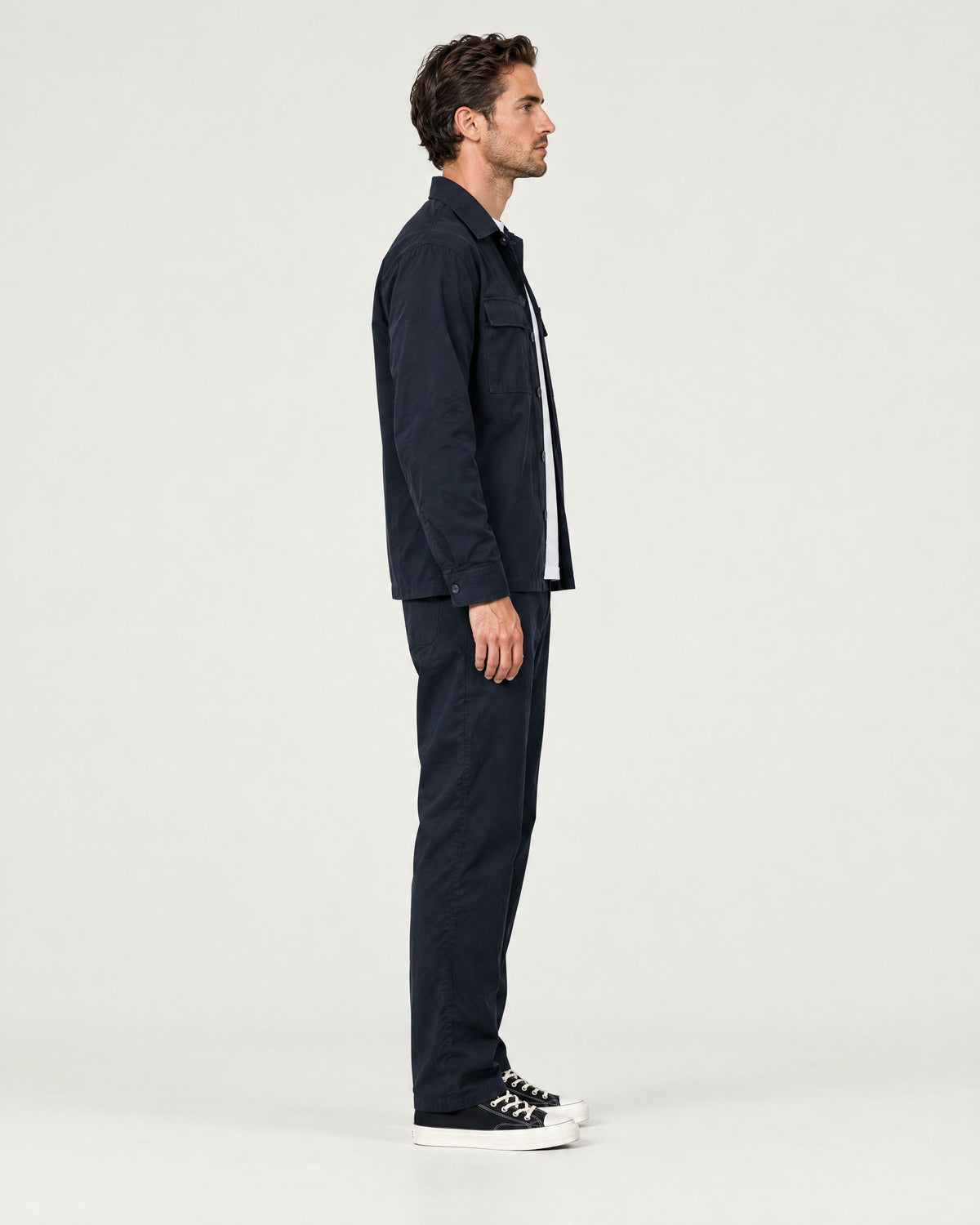 Romimi Relaxed Tech Suit in Black, side view, worn