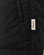 Romimi Reversible Windbreaker Gilet in Black, label close-up