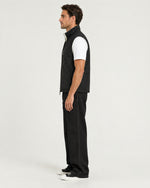 Romimi Reversible Windbreaker Gilet in Black, side view, worn
