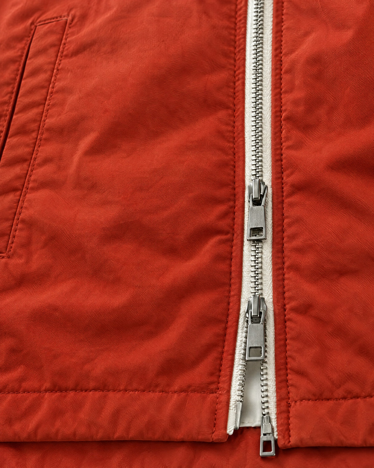 Romimi Reversible Windbreaker Gilet in Brick, fabric close-up