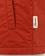 Romimi Reversible Windbreaker Gilet in Brick, label close-up