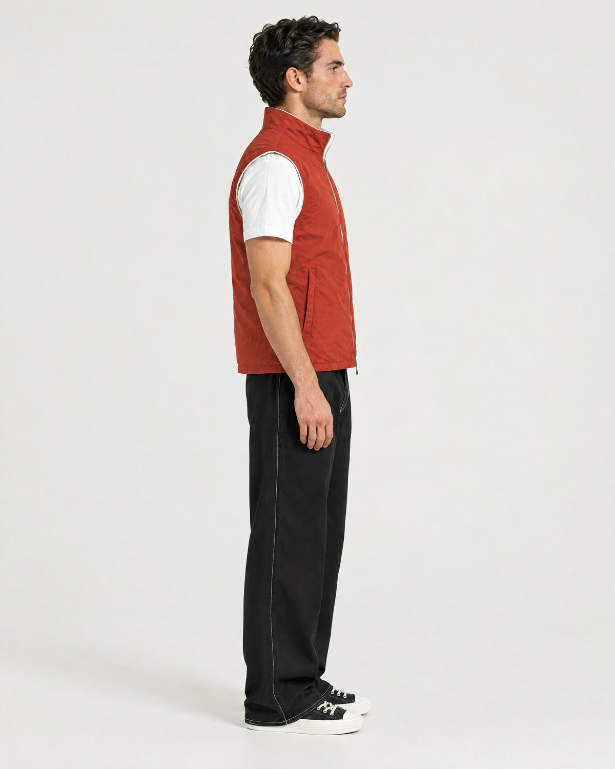 Romimi Reversible Windbreaker Gilet in Brick, side view, worn
