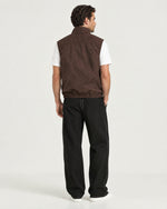 Romimi Reverso Gilet in Brown, back view, worn