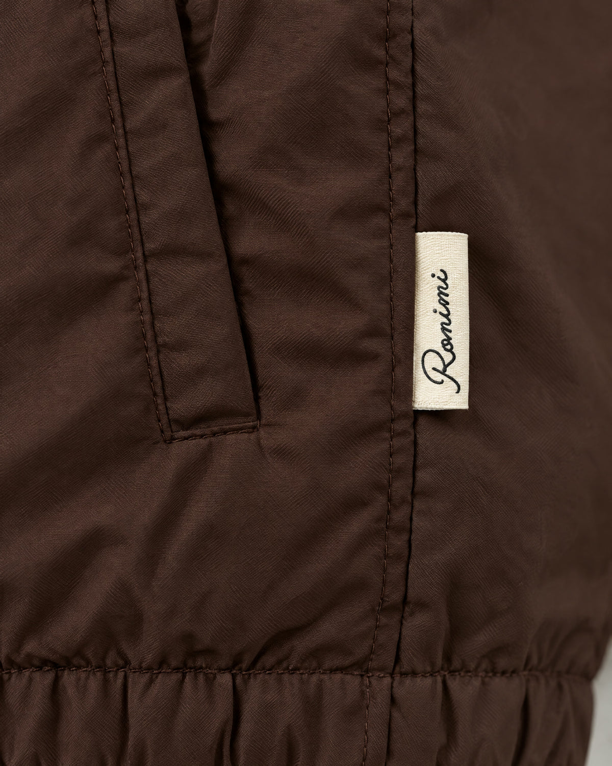 Romimi Reverso Gilet in Brown, label close-up