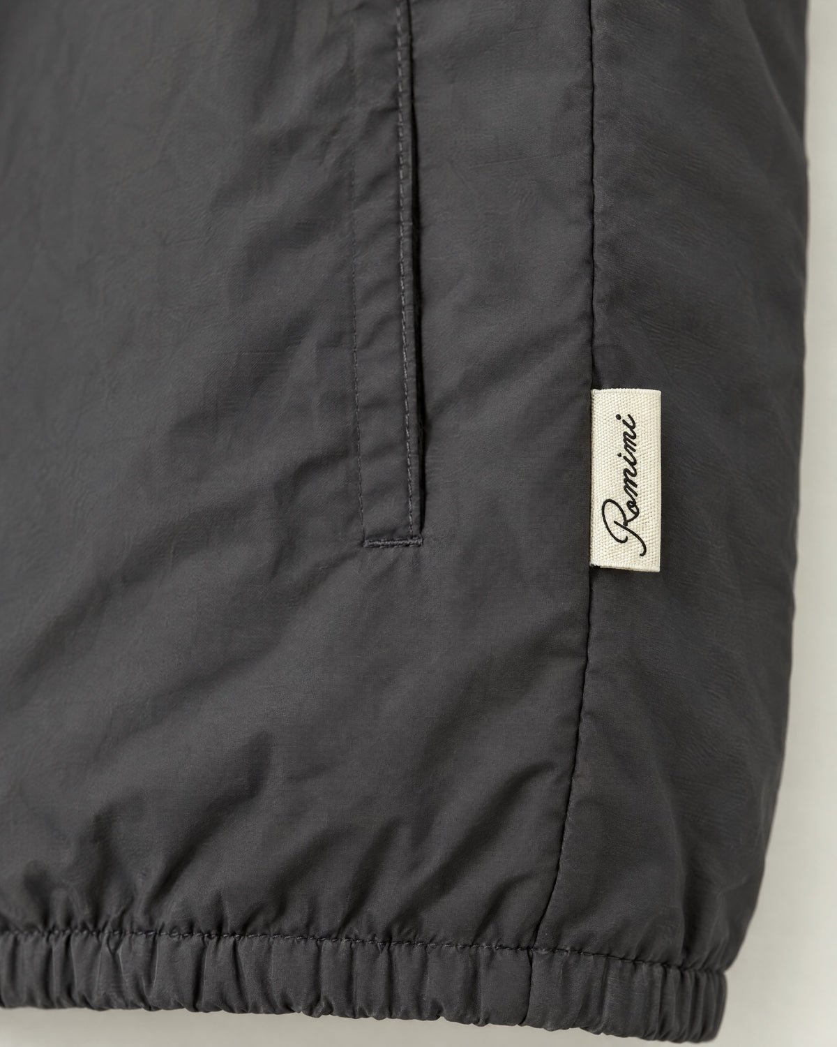 Romimi Reverso Gilet in Charcoal, label close-up