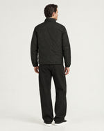 Romimi Reverso Jacket in Black, back view, worn