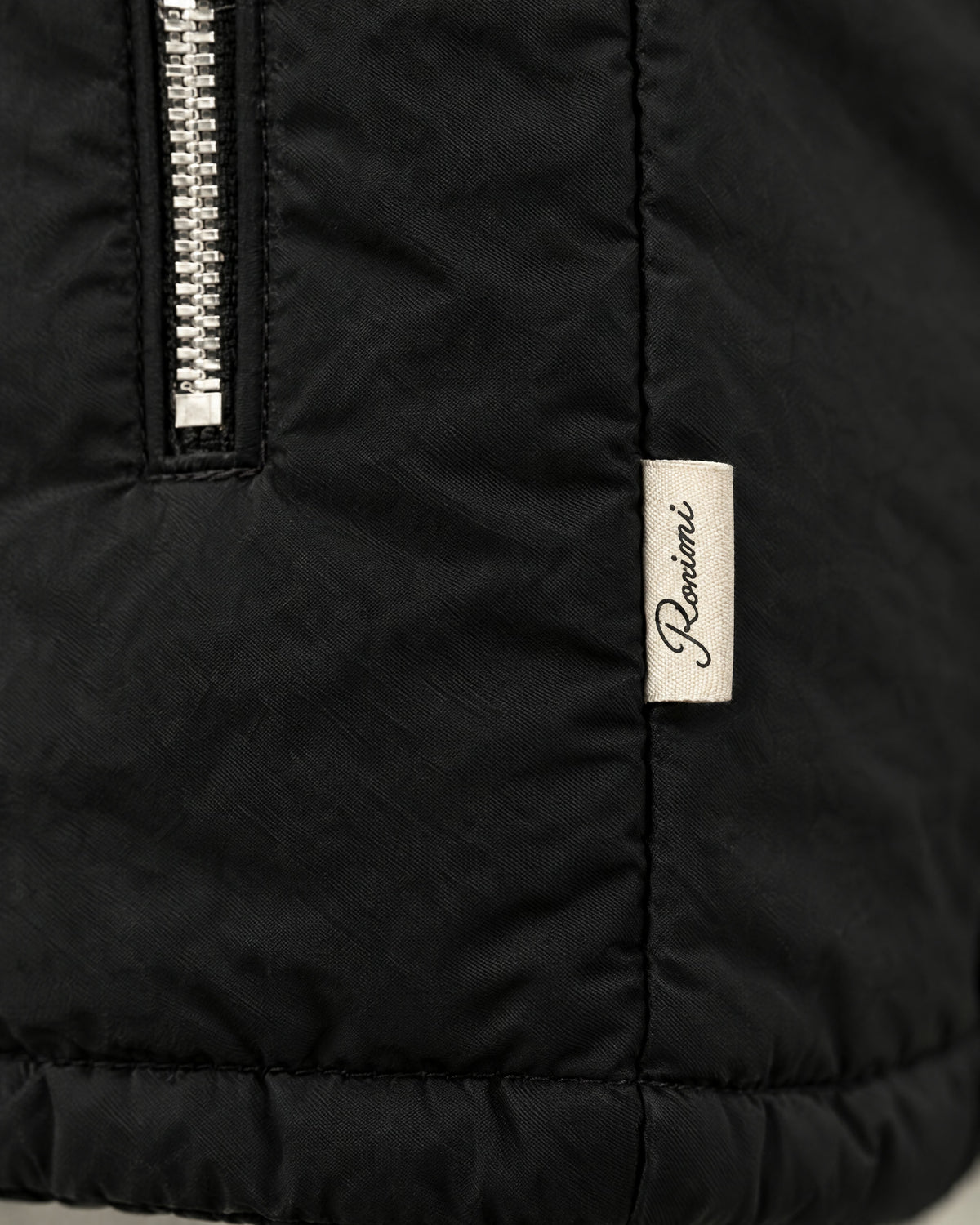 Romimi Reverso Jacket in Black, label close-up