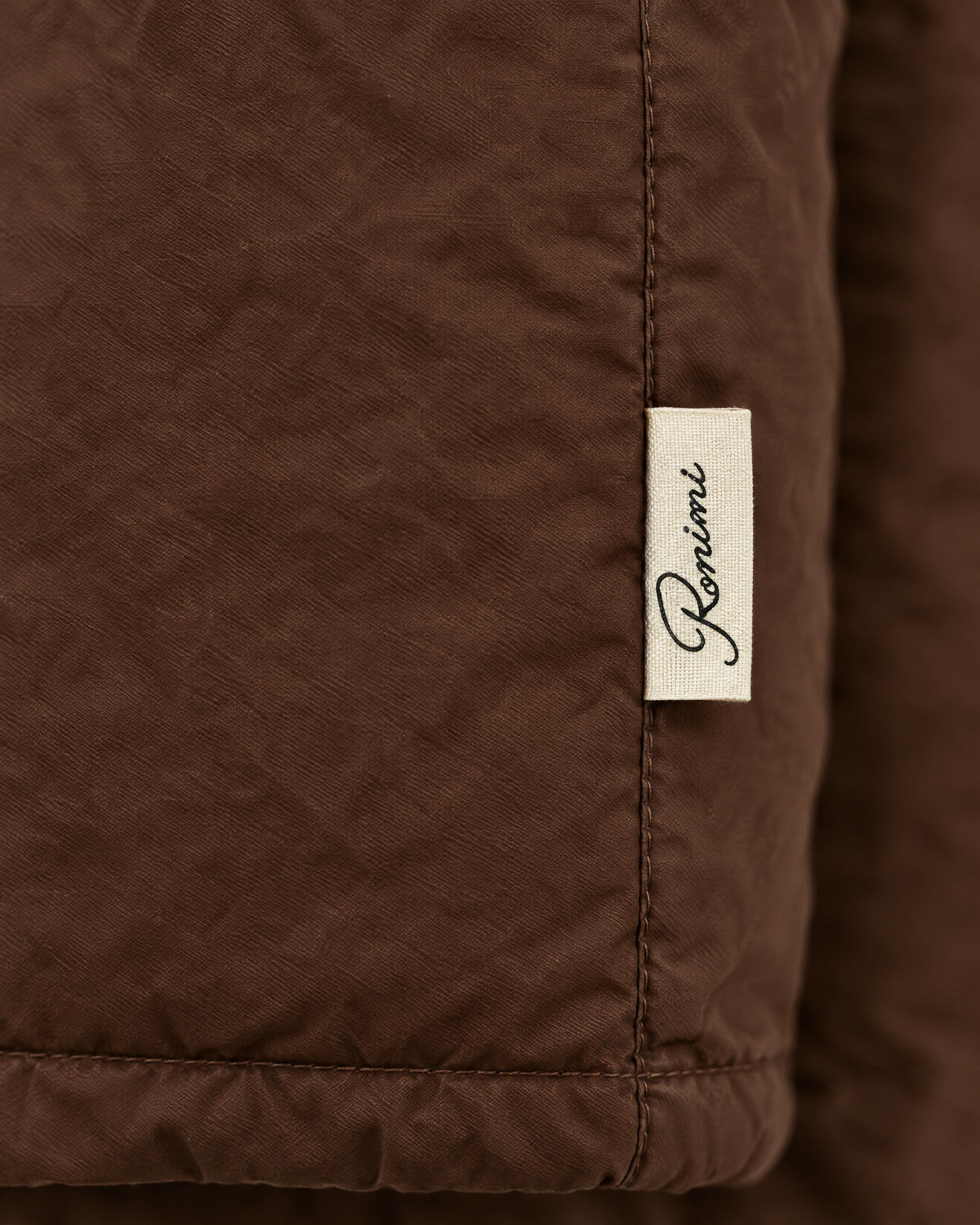 Romimi Reverso Jacket in Brown, label close-up