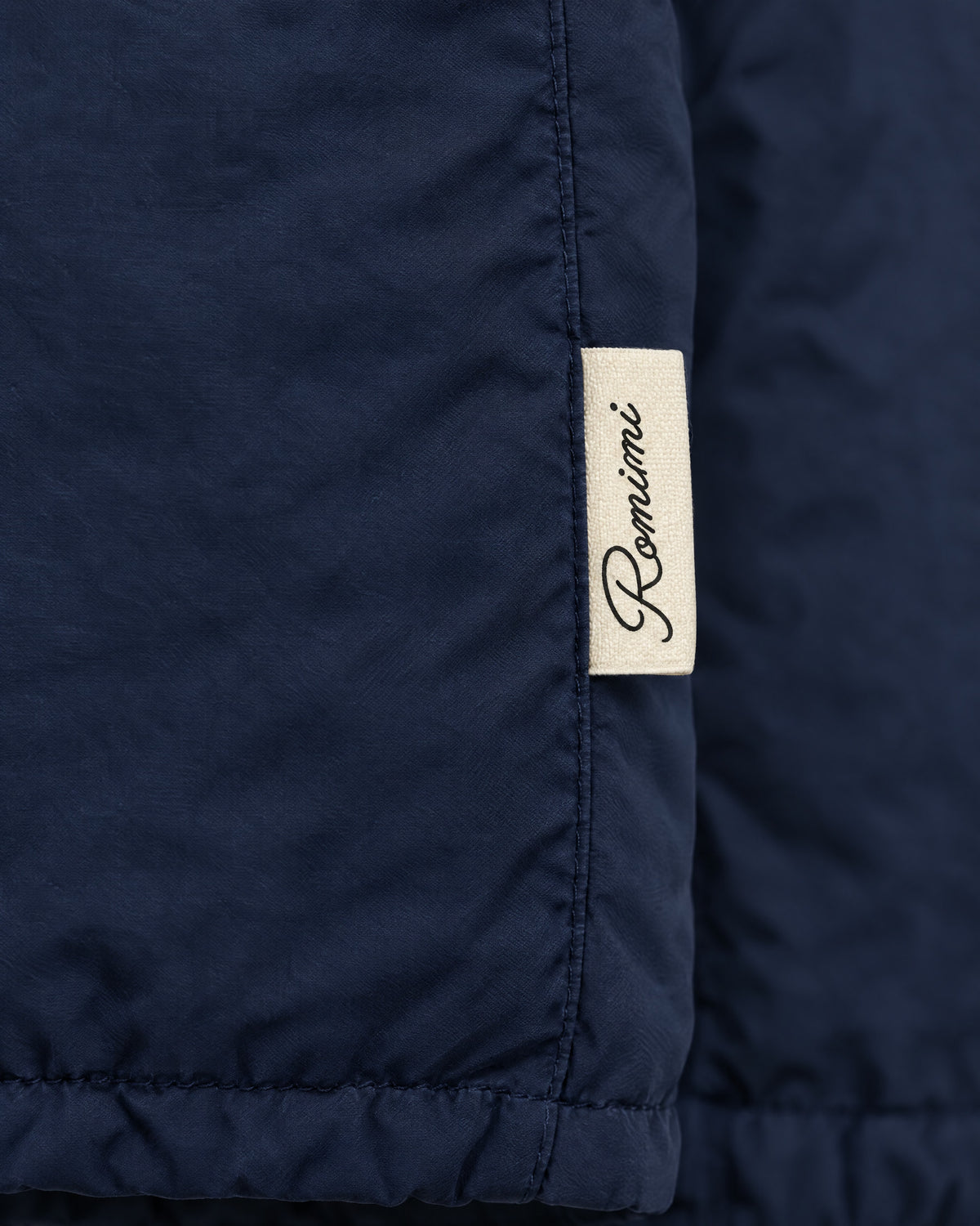 Romimi Reverso Jacket in Navy, label close-up