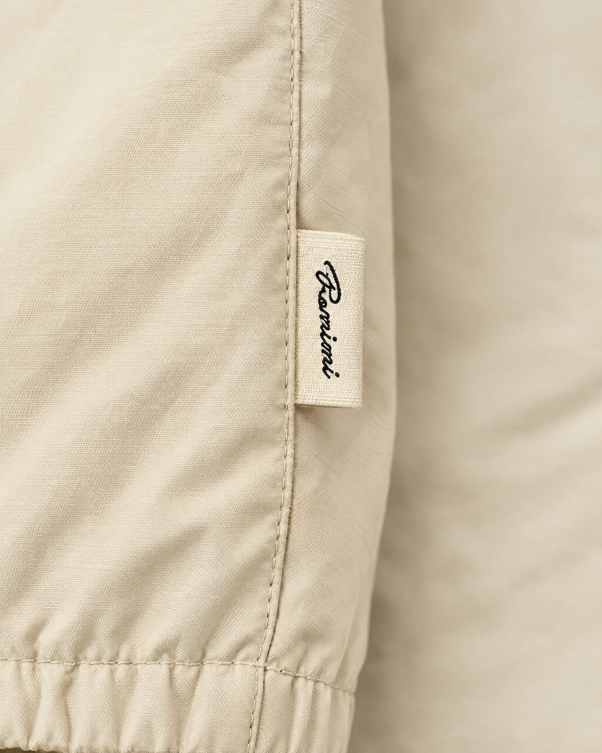 Romimi Reverso Set in Cream / Burgundy, label close-up