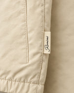 Romimi Reverso Set in Cream / Olive, label close-up