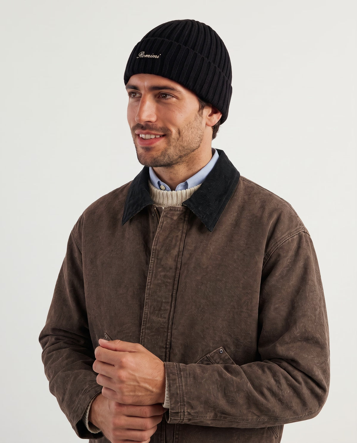 Man wearing the rib-knit beanie in black