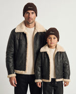 Father and son wearing the Romimi rib-knit beanie in chocolate