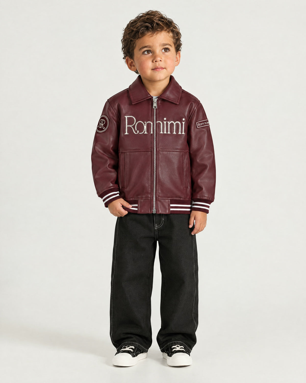 Little boy wearing the Romimi Signature Classic Bombers, front view