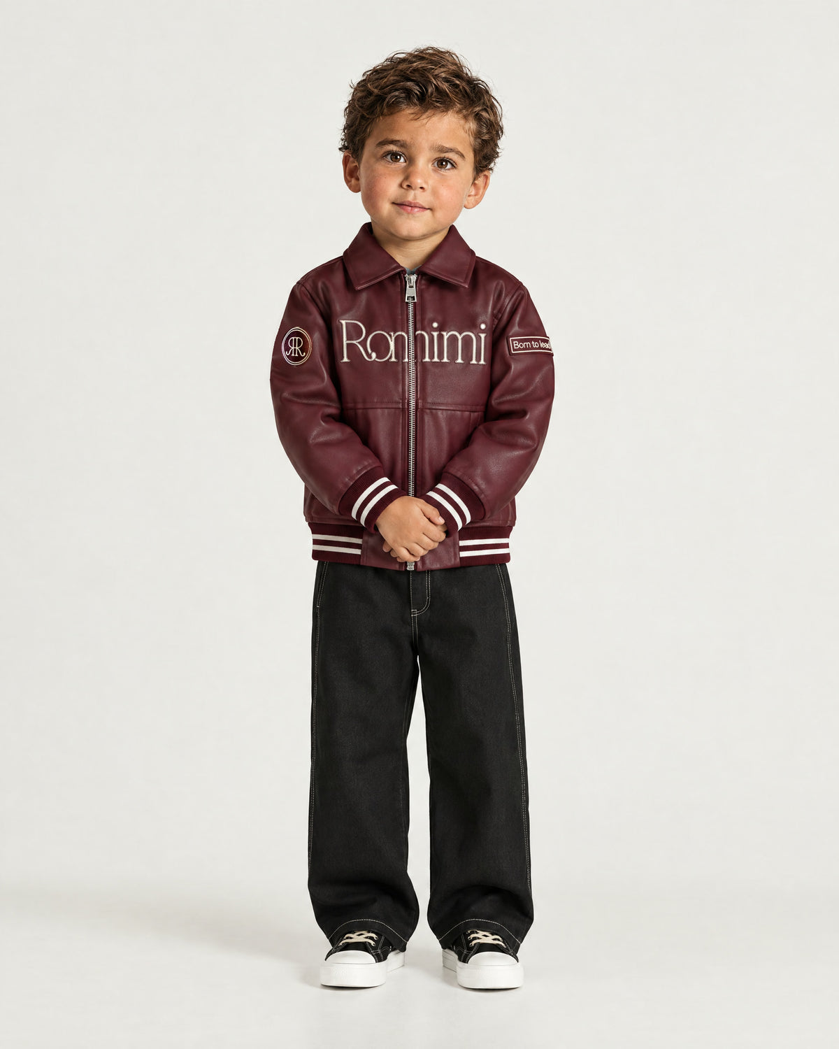 Little boy wearing the Romimi Signature Classic Bombers, full length