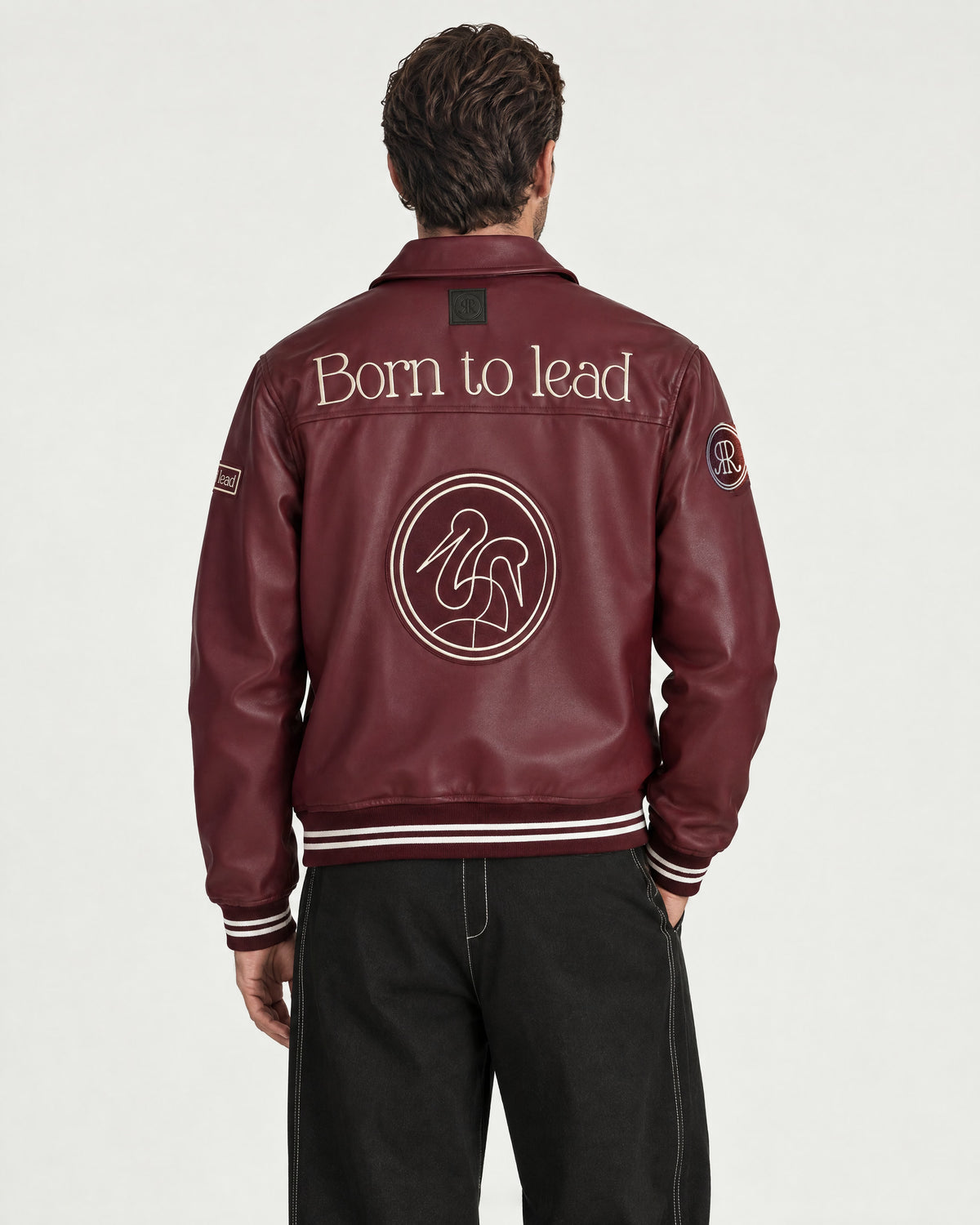 Man wearing the Romimi Signature Classic Bombers, back view